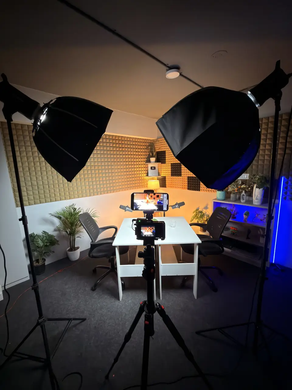Two Godox softboxes lighting a small podcast set