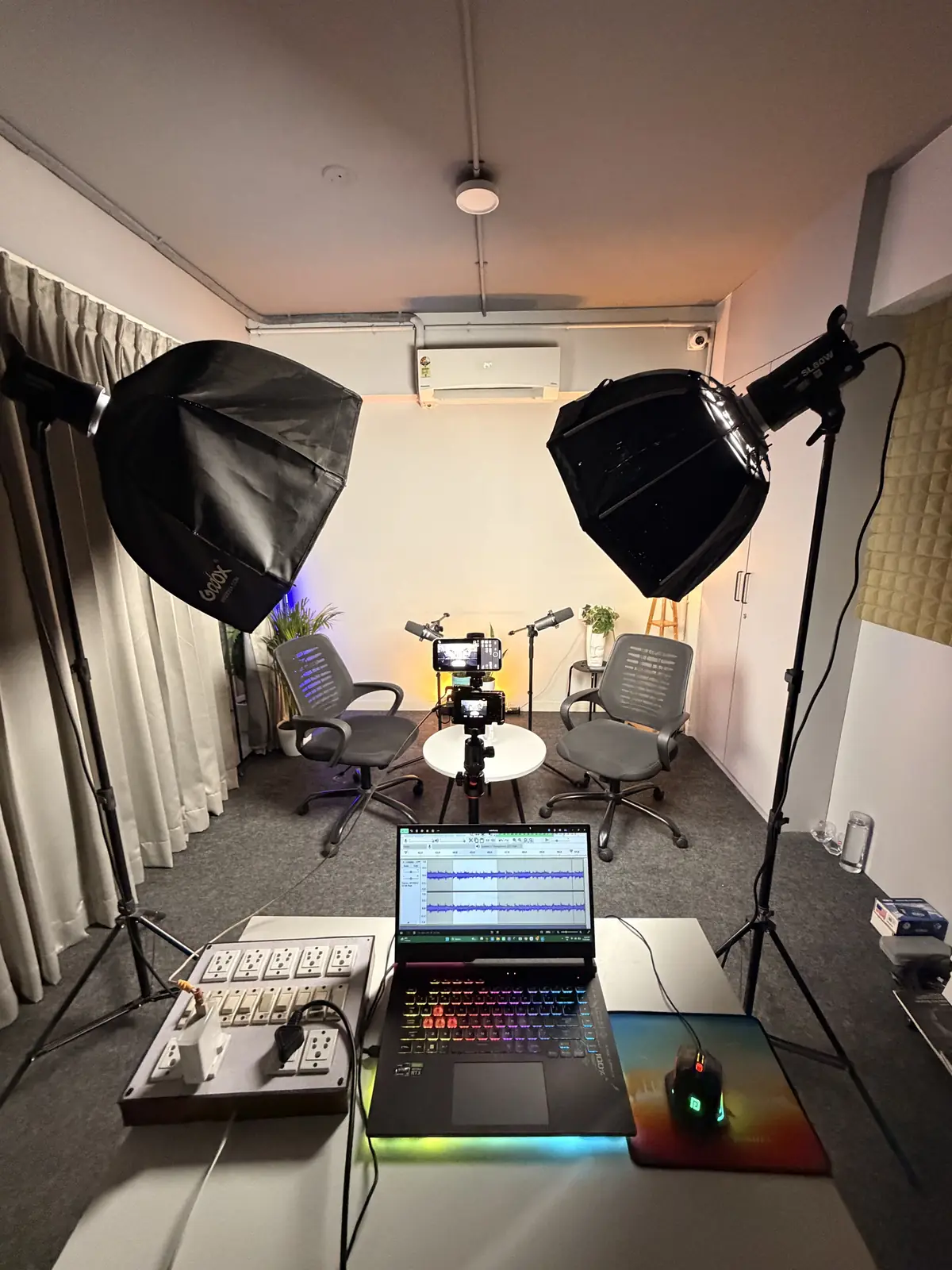White studio set lit by two Godox softboxes